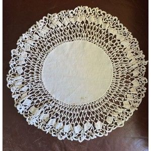 VINTAGE OFF WHITE HANDMADE CROCHET DOILIE. ROUND APROX. 13.5” Small stain/whole